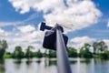 Dragonfly sits on tripod action camera in nature. Shooting nature action camera. Interesting insects