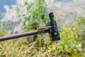 Dragonfly sits on tripod action camera in nature. Shooting nature action camera. Interesting insects