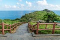 Dragons head reaching into the ocean with path at Yongmeori Beach, Sanbang-ro, Jeju Island, South Korea