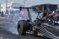 Dragster making a smoke show at the starting line Royalty Free Stock Photo