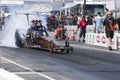 Dragster smoke show on the race track at the starting line