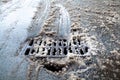 Drain grate and pothole on the road Royalty Free Stock Photo