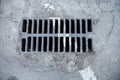 Drain grate with road marking line on it Royalty Free Stock Photo