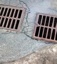 Drain grates on the road Royalty Free Stock Photo