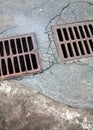 Drain grates on the road Royalty Free Stock Photo