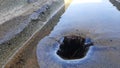 Drain hole. Pluvial drain at top of building