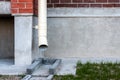 Drain pipe on the brown brick wall. Downspout Royalty Free Stock Photo