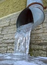 Drain pipe with frozen water Royalty Free Stock Photo