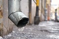 Drain pipe with frozen water in winter on Moscow street Royalty Free Stock Photo