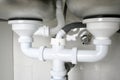 Drain pipes of a kitchen sink with dishwasher connection Royalty Free Stock Photo