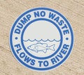 Drain sign - Dump no waste flows to river Royalty Free Stock Photo