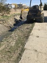 Drainage channel maintenance machine at work