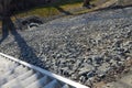 Drainage chute to the sewer and slope reinforced from erosion with gabions