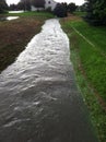 Drainage ditch full of rain water.