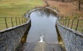 Drainage of drainage water from the bottom of the dam dam or pond through the upper safety overflow water overflow determines the