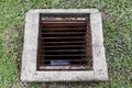 Drainage hole grating for water dirt old, Drain sewer pipe cement of dirty water waste on the lawn floor, Drainage hole cement Royalty Free Stock Photo