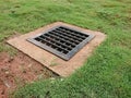 Drainage in the middle grass. Royalty Free Stock Photo