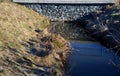 Drainage drainage reclamation channel is an outdated way to lower groundwater levels. dikes of gray stones. supplies water to irri Royalty Free Stock Photo