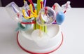 Drainer full of baby plastic tableware objects Royalty Free Stock Photo