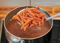 Draining Italian pasta gluten-free, with lentil flour Royalty Free Stock Photo