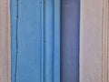 Drainpipe, guttering downpipe running down side of pastel colours house wall Royalty Free Stock Photo