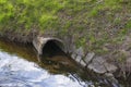 Drainpipe, pipe in a brook or river Royalty Free Stock Photo