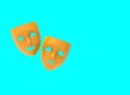 Drama and comedy theatrical masks isolated on blue background.