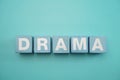 Drama word alphabet letters on blue background Royalty Free Stock Photo