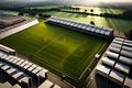 A dramatic aerial view of a rugby pitch, showcasing the intricate patterns of the field markings