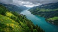 Dramatic alpine lake surrounded by lush green mountains and forest Royalty Free Stock Photo