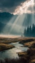 Dramatic Alpine Landscape With Sunbeams Filtered Through Storm Clouds Onto A Misty Marshy Stream Royalty Free Stock Photo
