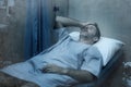 Dramatic artistic hospital portrait of attractive and scared man infected by covid19 - adult male in face mask receiving