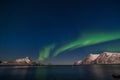 Dramatic aurora borealis, polar lights, over mountains in the North of Europe - Lofoten islands, Norway Royalty Free Stock Photo