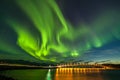 Dramatic aurora borealis, polar lights, over mountains in the North of Europe - Lofoten islands, Norway Royalty Free Stock Photo