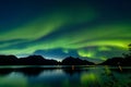 Dramatic aurora borealis, polar lights, over mountains in the North of Europe - Lofoten islands, Norway Royalty Free Stock Photo