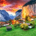 Dramatic autumn view of Lauterbrunnen valley with gorgeous Staubbach waterfall and Swiss Alps at sunset time