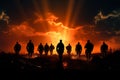 Dramatic backdrop enhances the impact of silhouetted soldiers in action