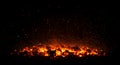 Glowing hot coals illuminate the dark night Royalty Free Stock Photo
