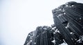 Dramatic basalt columns covered in winter snow Royalty Free Stock Photo