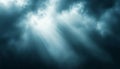 Dramatic and Beautiful Light Rays Breaking Through Dark Stormy Clouds in an Abstract Sky Scene Royalty Free Stock Photo
