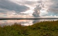 Dramatic beautiful pink blue orange sunset at river with reflection and clouds on natural background Royalty Free Stock Photo