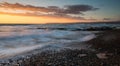 Beautiful dramatic Sunset over a rocky coast Royalty Free Stock Photo