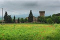 Dramatic beautiful view of green fields and meadows at sunset in Tuscany Royalty Free Stock Photo