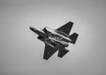 Dramatic black and white of an Air Force F-35 fighter jet soaring through the sky