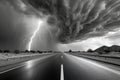 Dramatic black and white highway scene with intense lightning strike under stormy clouds Royalty Free Stock Photo