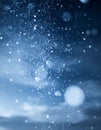 Dramatic Blue Bokeh Effect with Sparkling Glittering Particles on Dark Sky Royalty Free Stock Photo