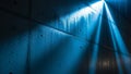 Dramatic blue light beams illuminate a wet concrete wall with textured surface Royalty Free Stock Photo