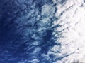 Dramatic view, windy day, blue sky with colorful white clouds natural background Royalty Free Stock Photo