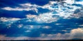 dramatic blue sky with clouds and sun rays Royalty Free Stock Photo