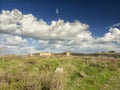 Dramatic blue sky with white clouds over the ruins of the ancient greek colony of Histria, on the shores of Black Sea. Histria is Royalty Free Stock Photo